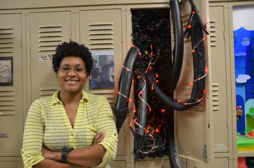 Woman standing by locker