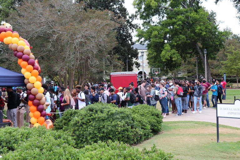 Students standing outside in line
