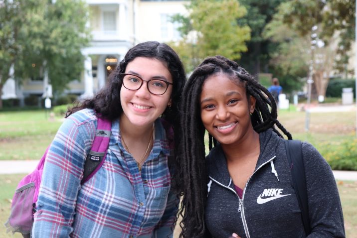 Two female students smiling at camera