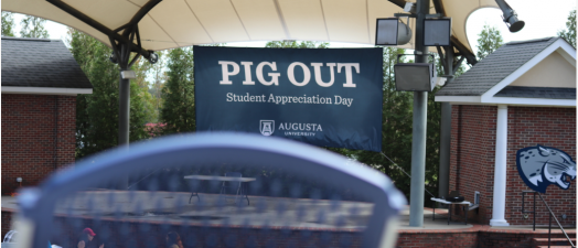 sign on a stage that says pig out