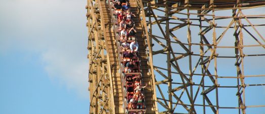 People going downhill on wooden rollercoaster