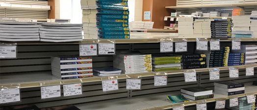Stacks of college psychology textbooks