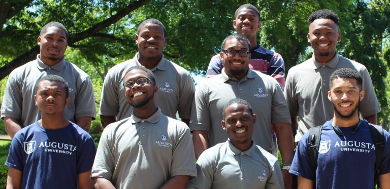 group of people smiling for photo