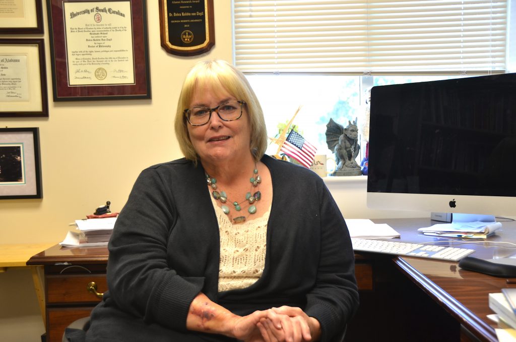 Woman sitting at a desk.