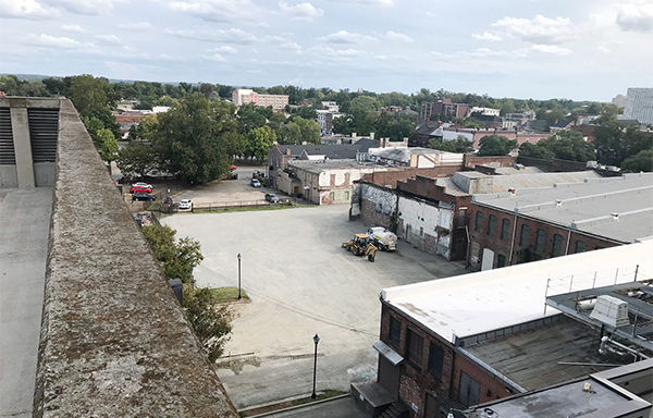 empty dirt lot behind building