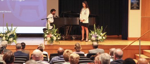 Man plays piano and woman sings