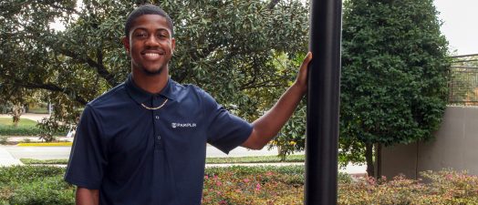 man standing outside for a photo