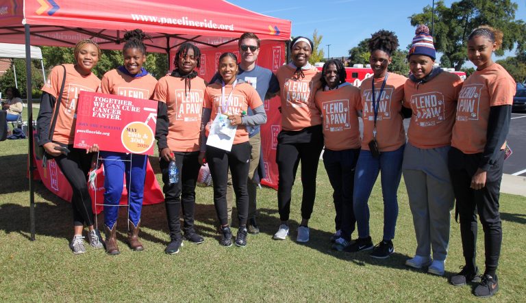 A group of people standing for picture