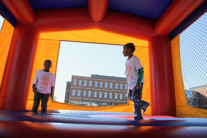 Two kids in a bounce house