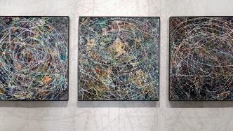 Three paintings on a wall.