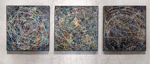 Three paintings on a wall.