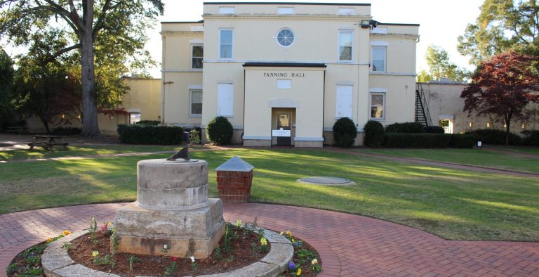 photo of a yellow building on campus