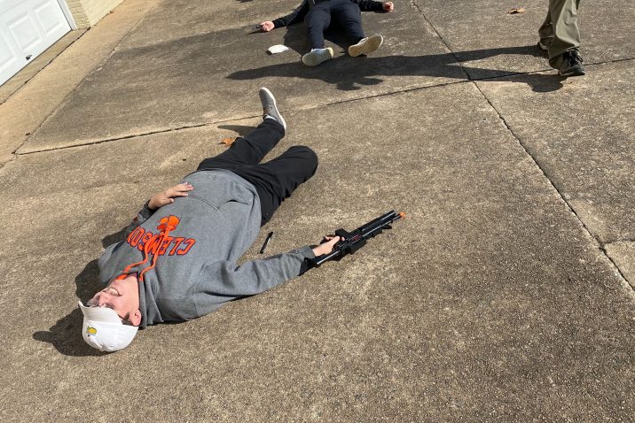 students laying on the ground