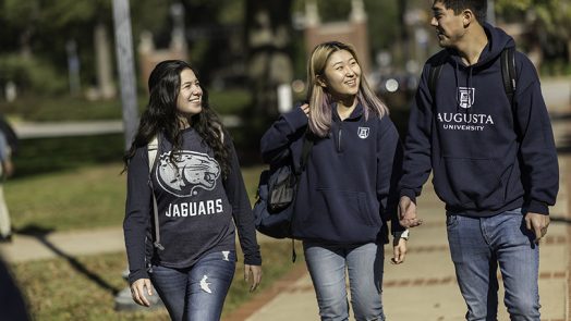 3 students wearing Augusta University shirts