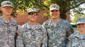 military students smiling for a photo