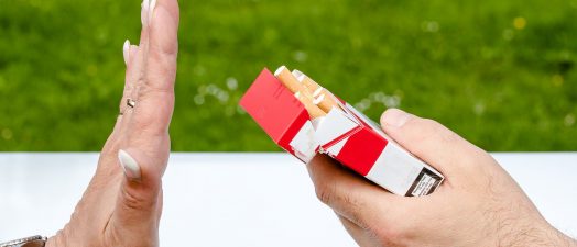Photo of someone saying "No" to a pack of cigarettes.