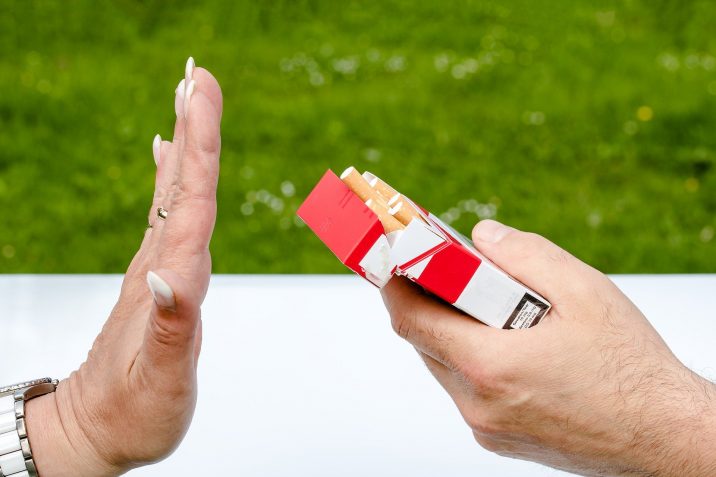 Photo of someone saying "No" to a pack of cigarettes.