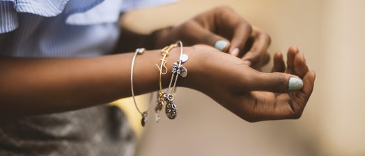 person wearing three bangles