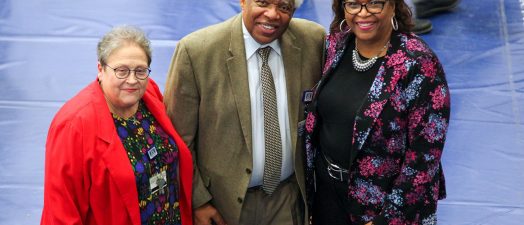Three people standing