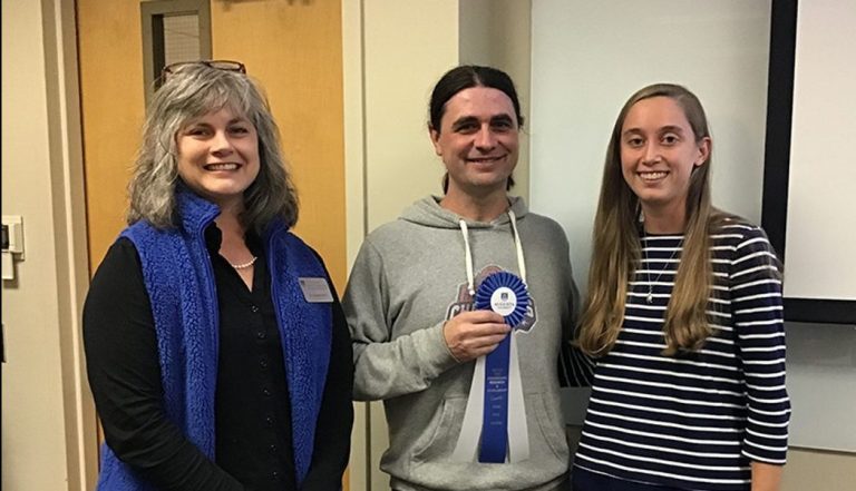 Three people standing