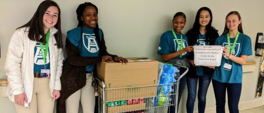 students standing around a cart