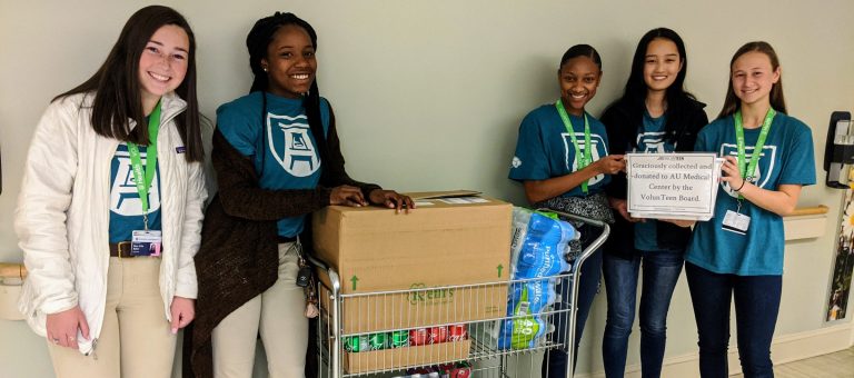 students standing around a cart
