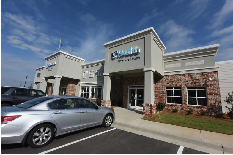 photo of a building and a car