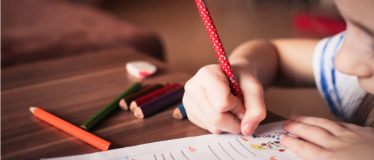 girl writing on paper