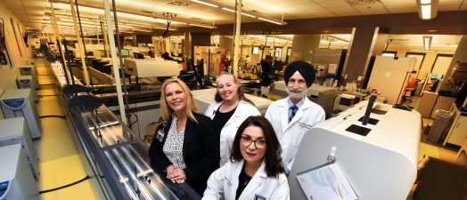 group of doctors sitting in a lab