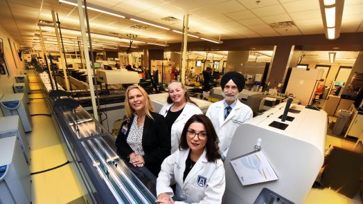 group of doctors sitting in a lab