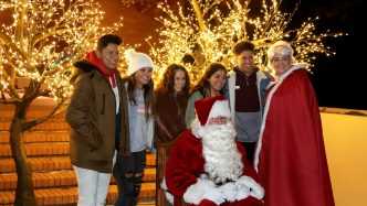people standing for a photo with Santa
