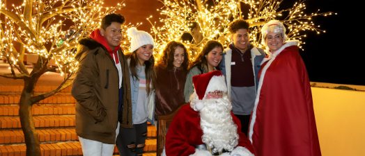 people standing for a photo with Santa