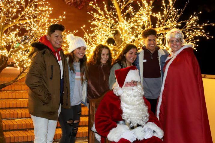 people standing for a photo with Santa