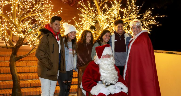 people standing for a photo with Santa