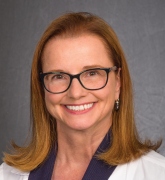 woman smiling for her headshot photo