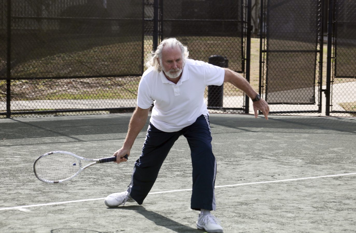 Man hitting a tennis ball.