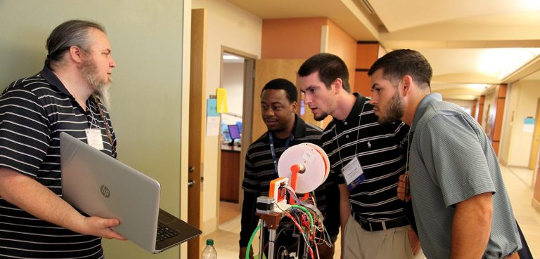people looking at a computer