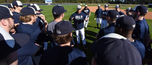 Coach talking to players