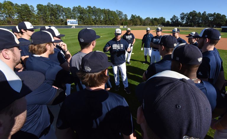 Coach talking to players
