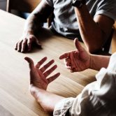three people at table discussion