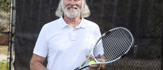 A man holding a tennis racket