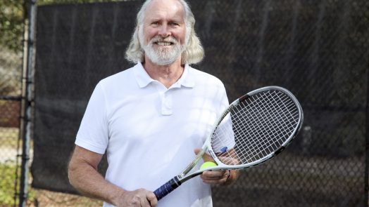 A man holding a tennis racket