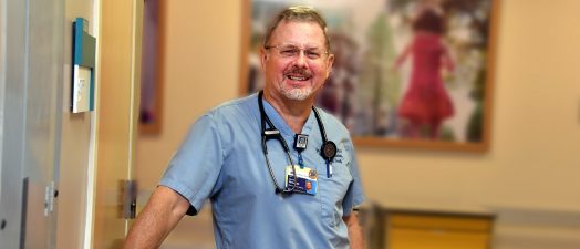 doctor smiling in a hallway