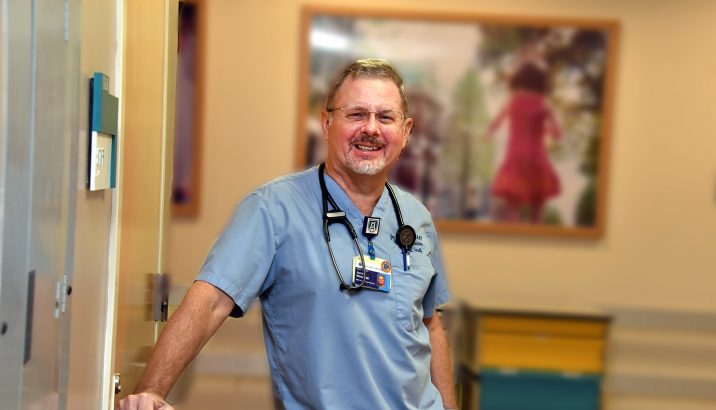 doctor smiling in a hallway