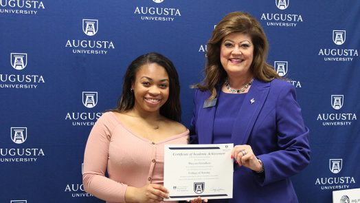 two women smiling for a photo
