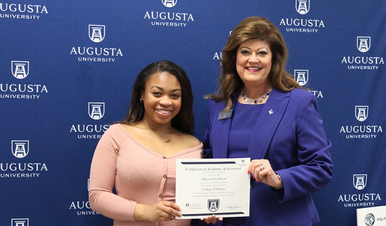 two women smiling for a photo
