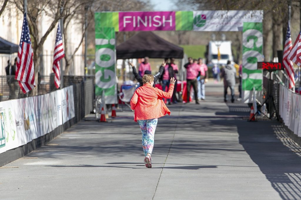 marathon runner back toward finish line