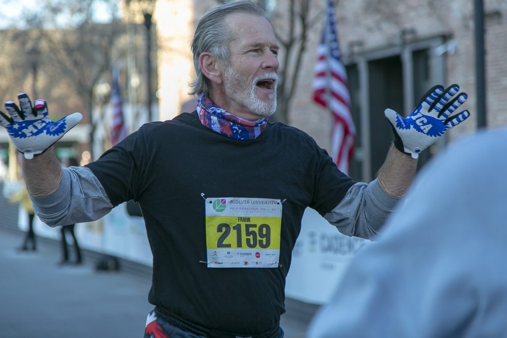 marathon runner breaks finish line