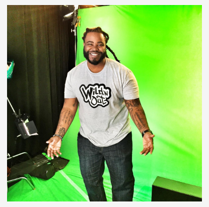 image of man in a grey Wild ‘N Out T-shirt