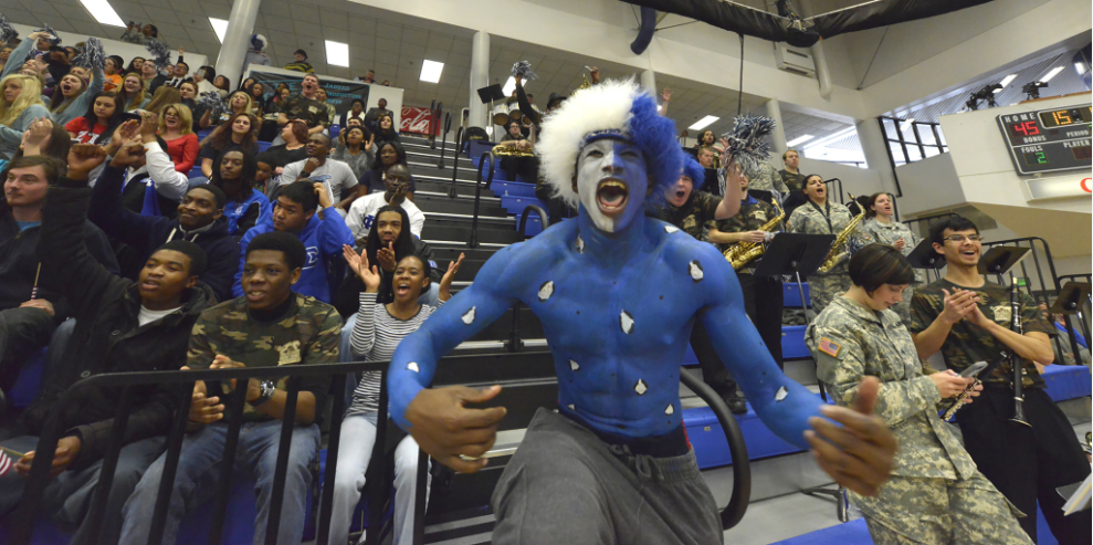 man screaming with school spirit